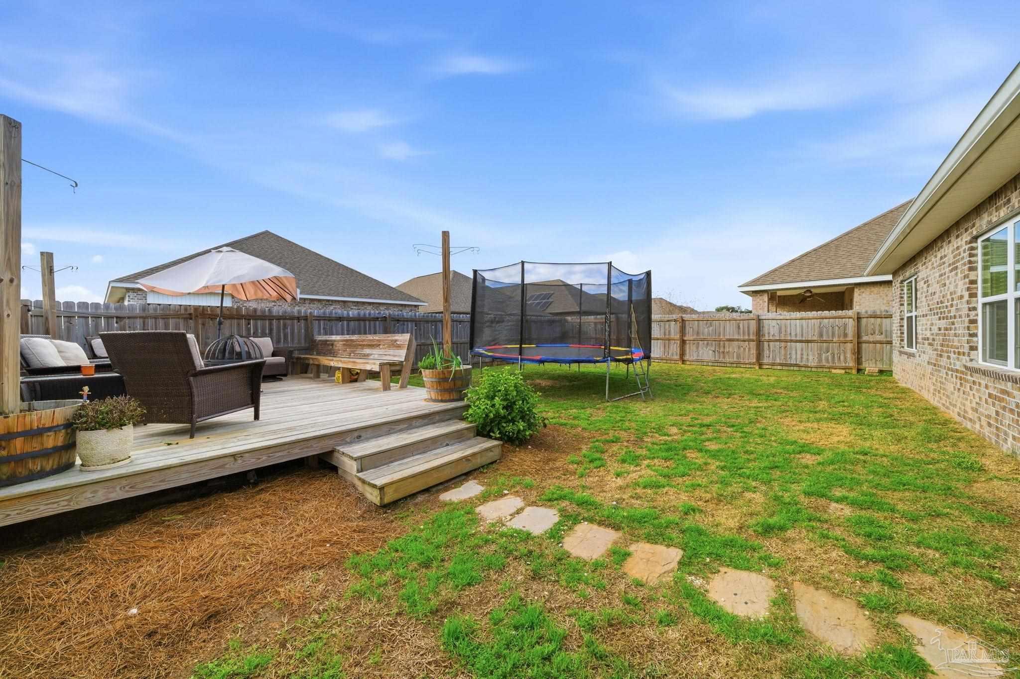 3797 Hawks Landing Circle Pace, FL 32571 - Photo 23 of 26 a view of a house with a yard