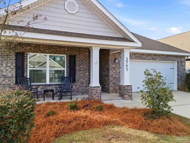 a front view of house with outdoor seating