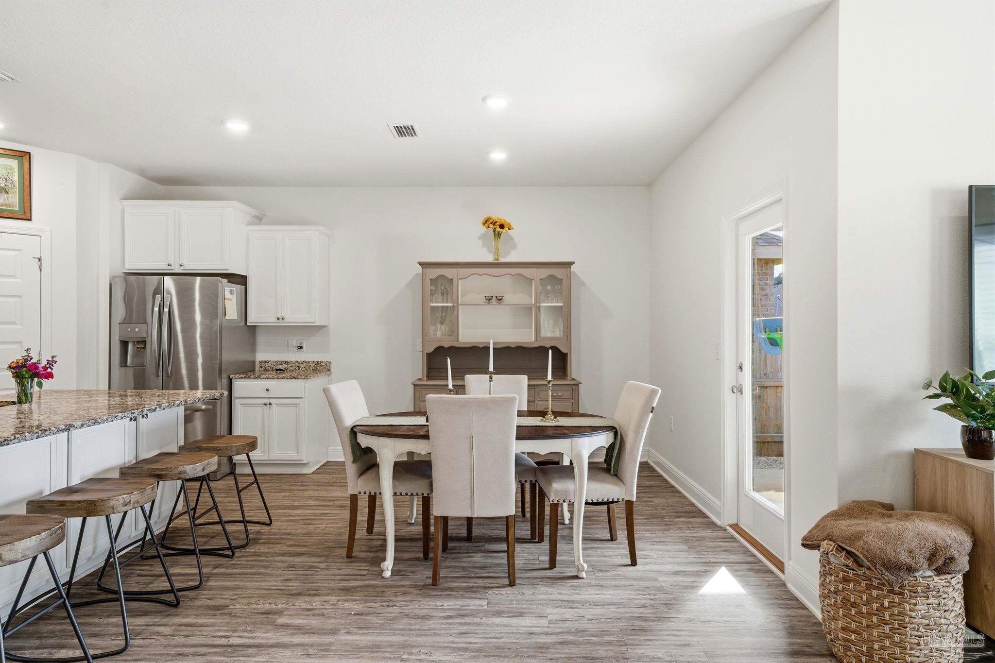 3797 Hawks Landing Circle Pace, FL 32571 - Photo 7 of 26 a view of a dining room with furniture