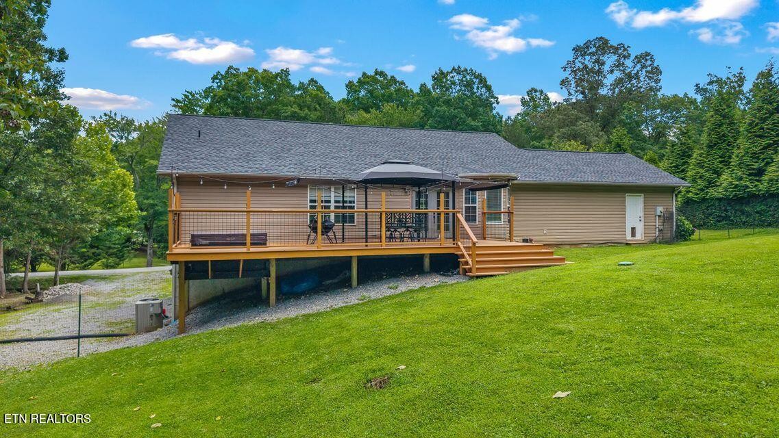 61 County Road 100 Decatur, TN 37322 - Photo 33 of 40 a view of a house with a backyard