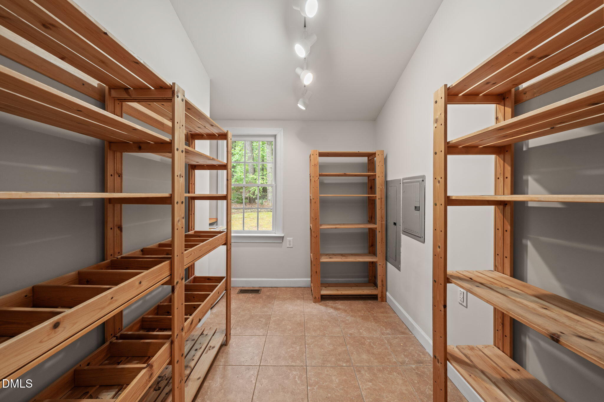 5809 Stone Spring Road Raleigh, NC 27613 - Photo 20 of 54 a view of walk in closet with empty racks