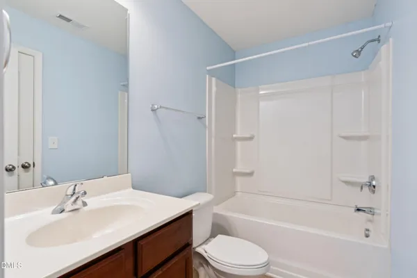 an empty room with closet area