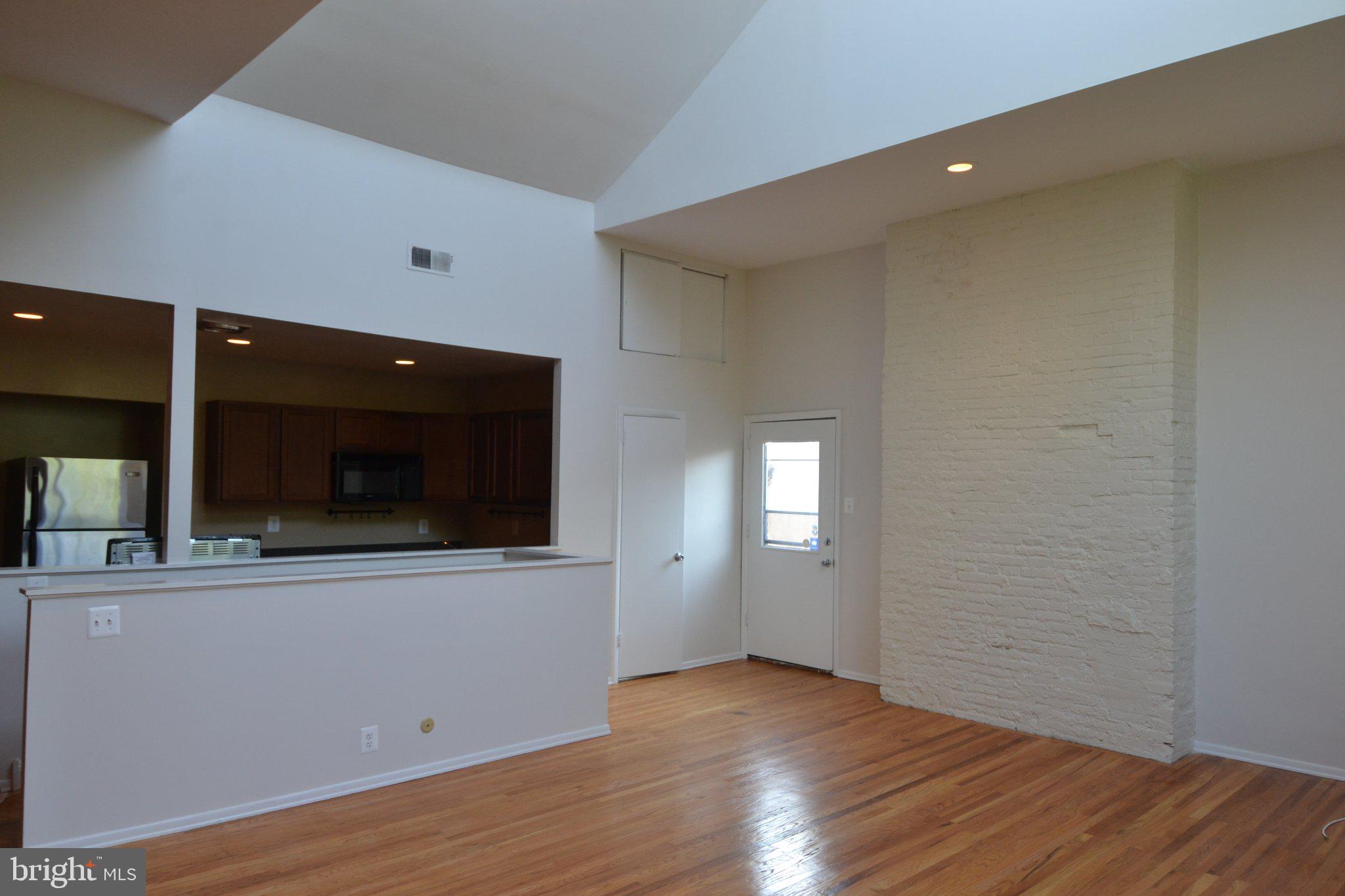 1010 Clinton Street, Unit 3M Philadelphia, PA 19107 - Photo 8 of 15 Spacious living area with natural light.