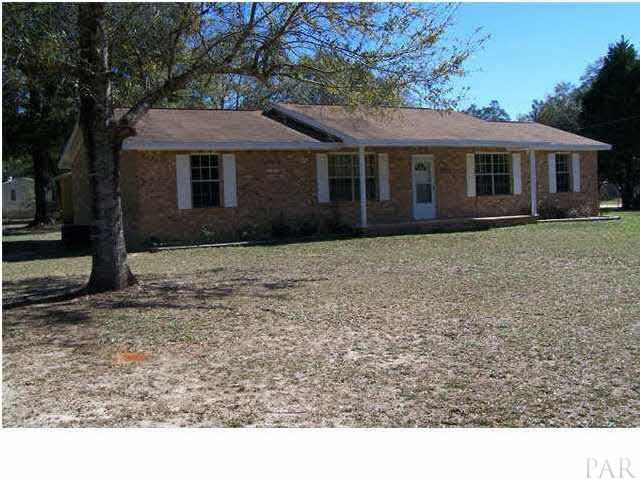 5376 Persimmon Hollow Road Milton, FL 32583 - Photo 1 of 12 Welcome to 5376 Persimmon Hollow home in Milton. Beautiful azealas and Heritage Oaks glamour this yard...all fenced with front and side single also double entrances. (2) ALL BRICK Dwellings: Home and Apartment with Garage.