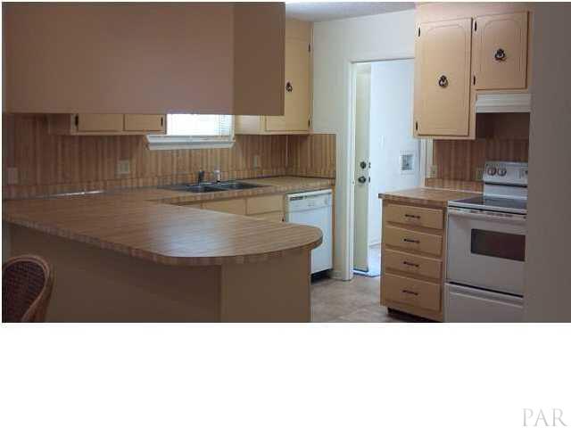 5376 Persimmon Hollow Road Milton, FL 32583 - Photo 6 of 12 Enjoyable Kitchen, eat-at bar, window over the deep, stainless sinks to view backyard activity, laminate countertops, many cabinets and ALL appliances convey