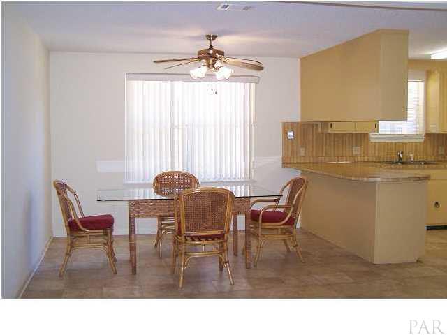 5376 Persimmon Hollow Road Milton, FL 32583 - Photo 7 of 12 Spacious dining room area OPEN to kitchen and living room areas