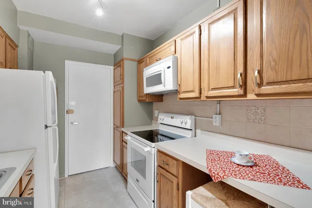 a kitchen with stainless steel appliances cabinets and a kitchen counter space