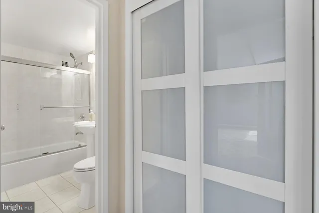 a bathroom with a shower and toilet