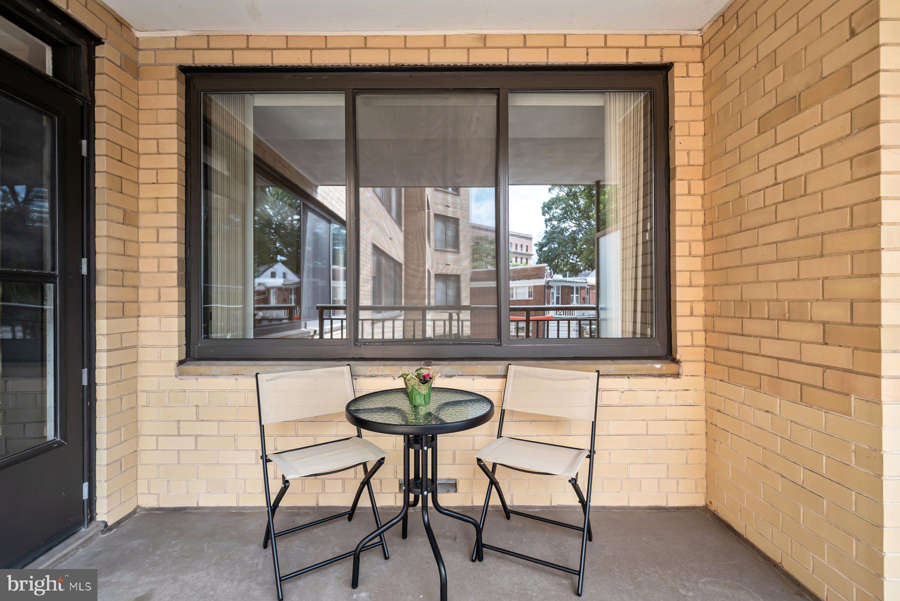4740 Connecticut Avenue Northwest, Unit 414 Washington, DC 20008 - Photo 19 of 33 a balcony with table and chairs