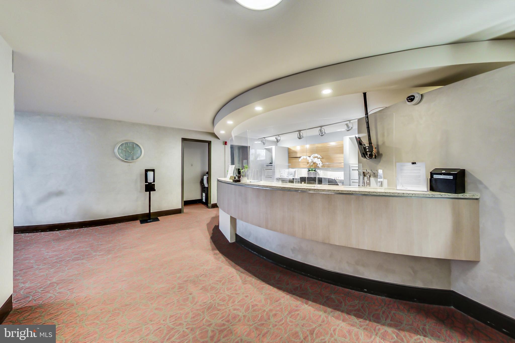 4740 Connecticut Avenue Northwest, Unit 414 Washington, DC 20008 - Photo 23 of 33 a living room with kitchen island granite countertop furniture and a ceiling fan