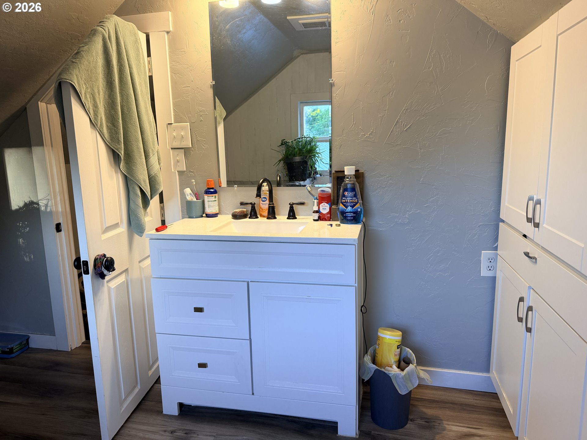 677 Southeast Moffitt Road Waldport, OR 97394 - Photo 29 of 36 a bathroom with a sink mirror vanity and toilet