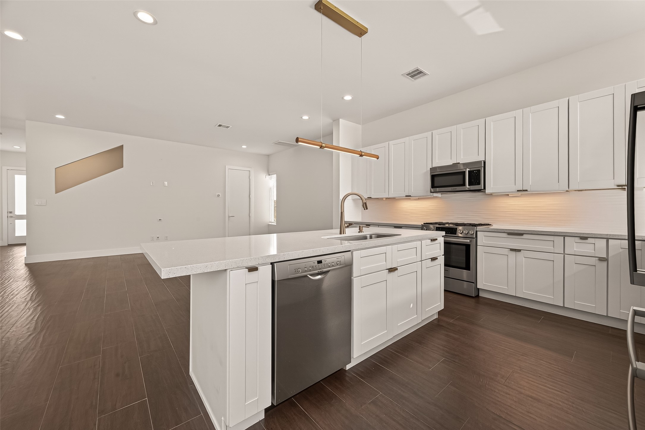 5505 Robusto Place Houston, TX 77091 - Photo 13 of 49 a kitchen with appliances cabinets and a sink