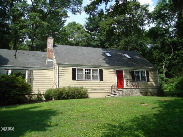 27 Hitchcock Road Westport, CT 06880 - Photo 1 of 1 a view of a house with a yard