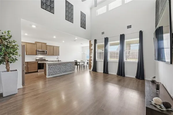 a view of kitchen with cabinets and wooden floor