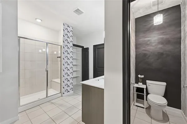 a bathroom with a shower and a toilet