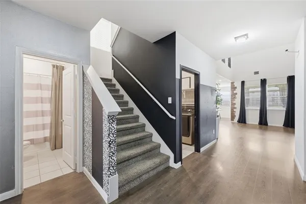 a view of a hallway with staircase