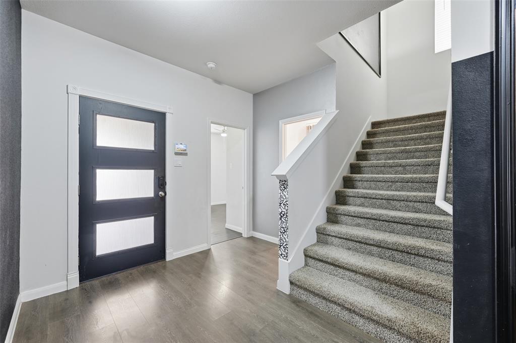 617 Range Drive Princeton, TX 75407 - Photo 2 of 26 a view of an entryway with wooden floor
