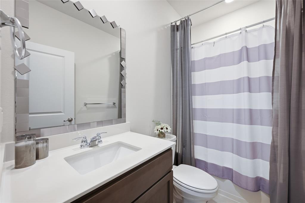 617 Range Drive Princeton, TX 75407 - Photo 22 of 26 a bathroom with a sink toilet tub and shower