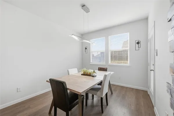 a view of a dining room with furniture and window