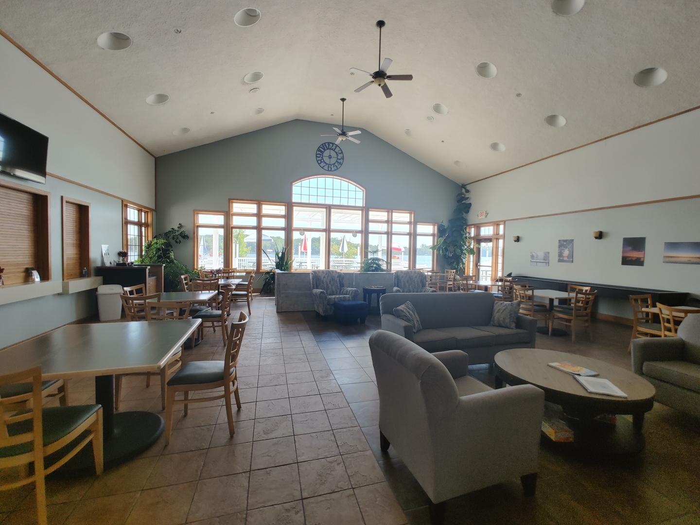 327 Rochester Road Northeast Poplar Grove, IL 61065 - Photo 14 of 20 a living room with furniture a chandelier and a dining table