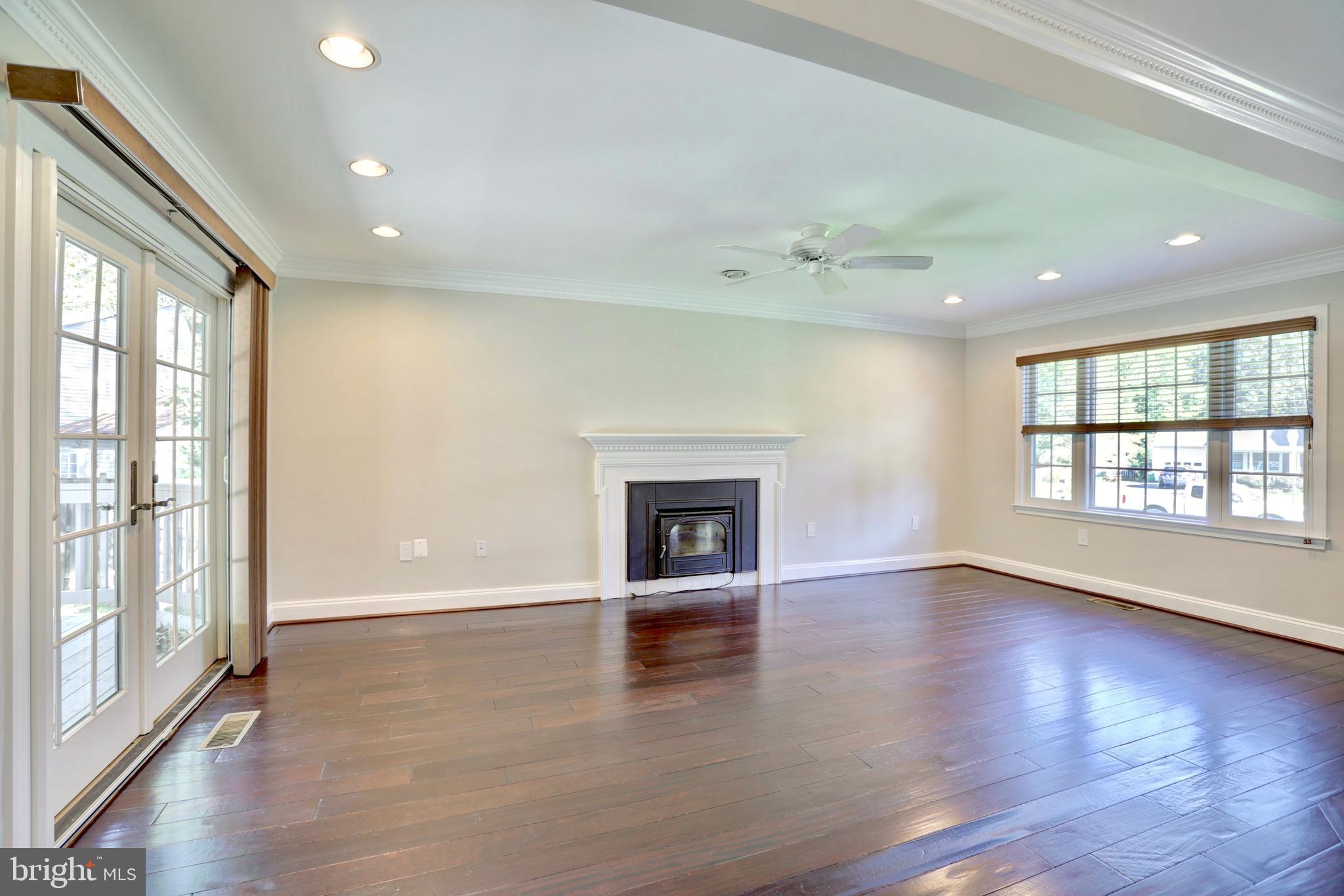 2336 Rosedown Drive Reston, VA 20191 - Photo 5 of 30 FAMILY ROOM WITH FIREPLACE AND WOOD STOVE INSERT
