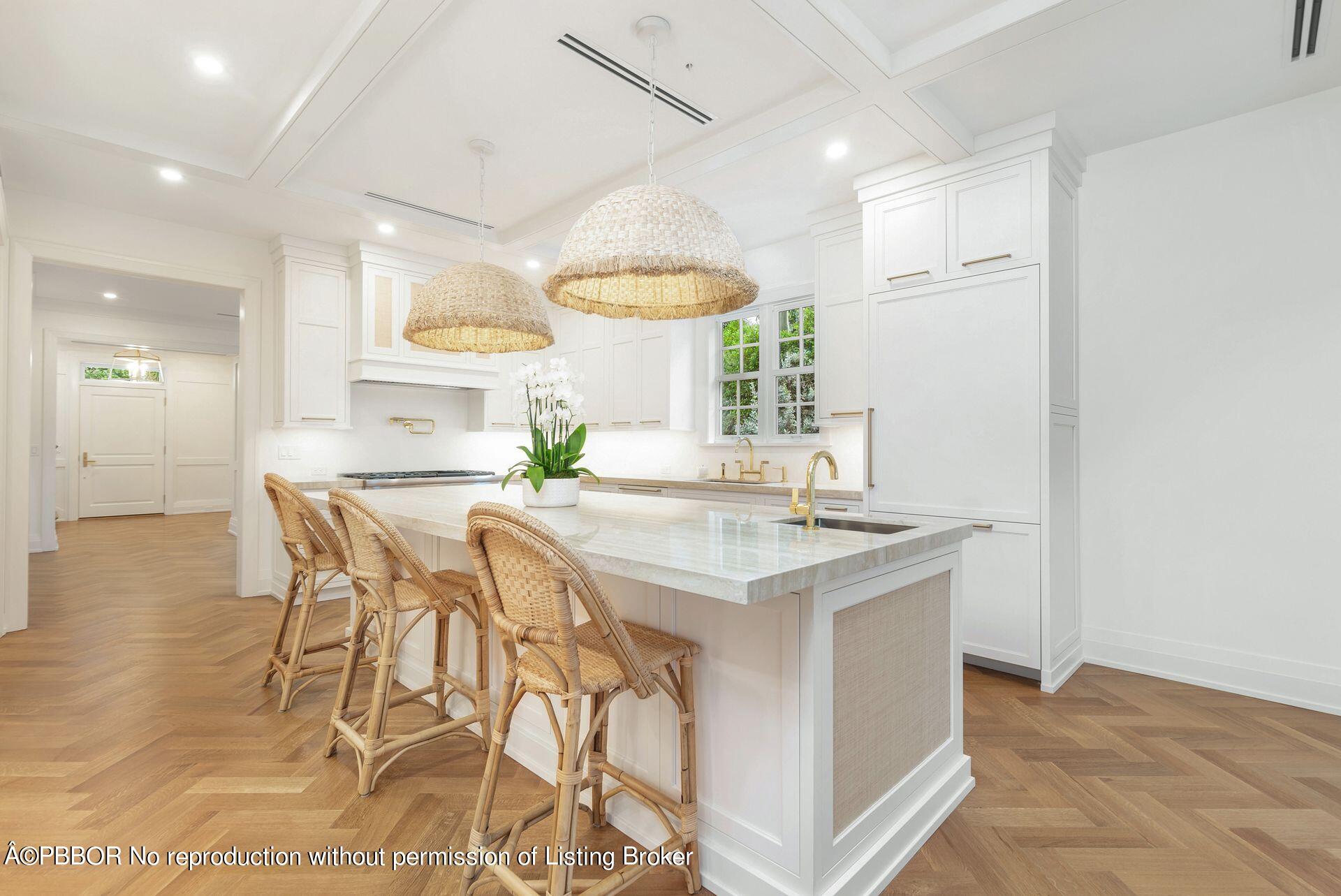 320 Sunset Road West Palm Beach, FL 33401 - Photo 12 of 35 a kitchen with a table and chairs in it