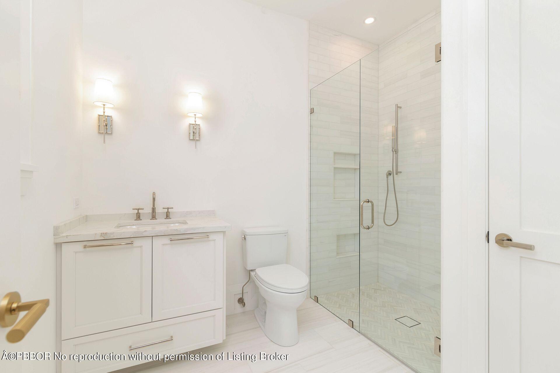 320 Sunset Road West Palm Beach, FL 33401 - Photo 18 of 35 a bathroom with a granite countertop sink a toilet and shower