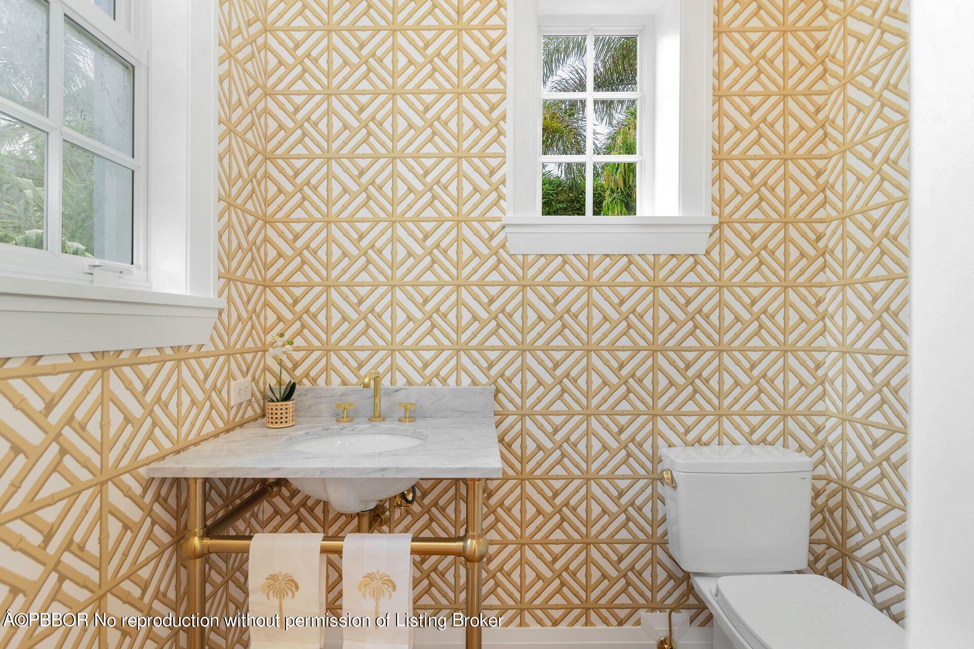 320 Sunset Road West Palm Beach, FL 33401 - Photo 19 of 35 a bathroom with a sink and a toilet