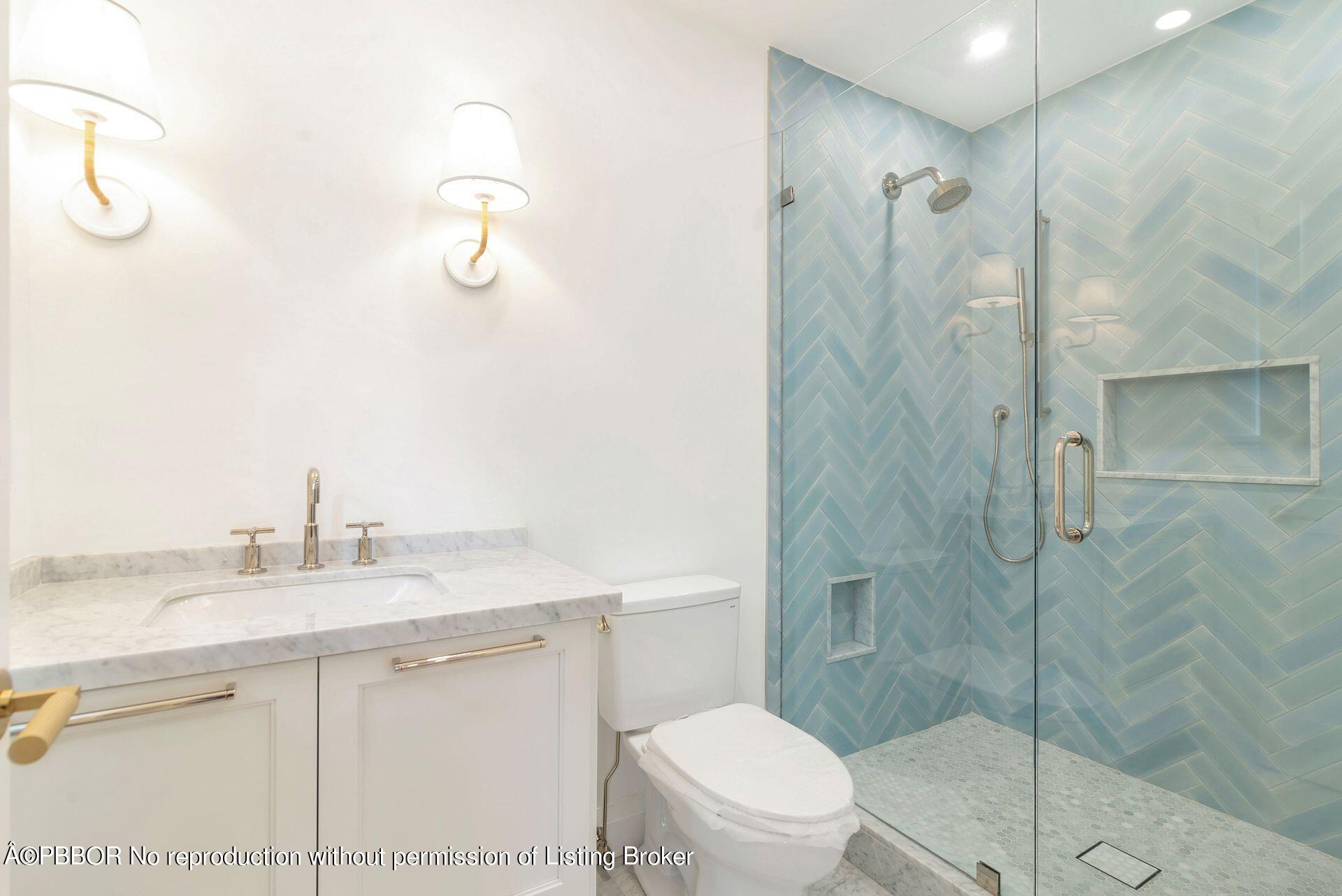 320 Sunset Road West Palm Beach, FL 33401 - Photo 20 of 35 a bathroom with a shower sink vanity mirror and toilet