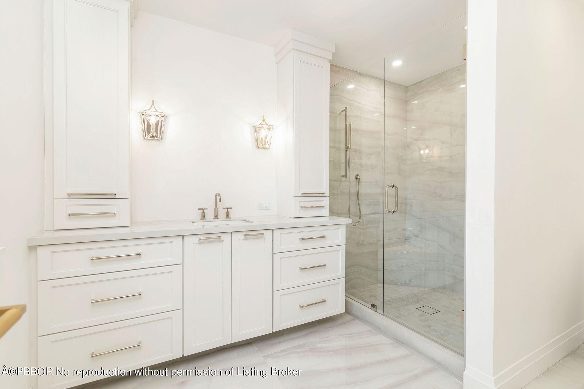 320 Sunset Road West Palm Beach, FL 33401 - Photo 21 of 35 a bathroom with a shower sink and mirror