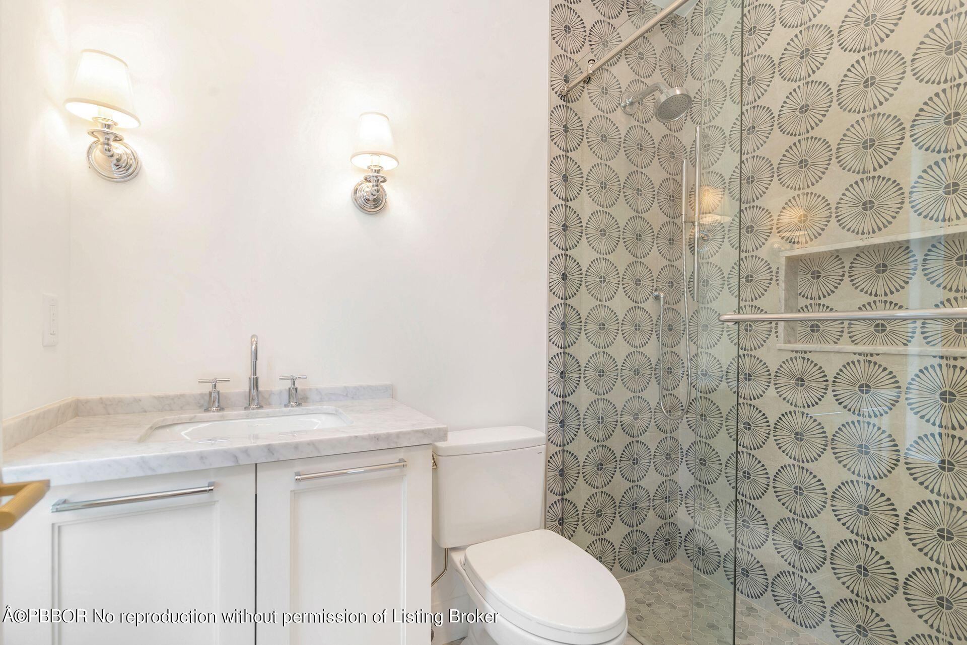 320 Sunset Road West Palm Beach, FL 33401 - Photo 25 of 35 a bathroom with a sink a toilet and shower