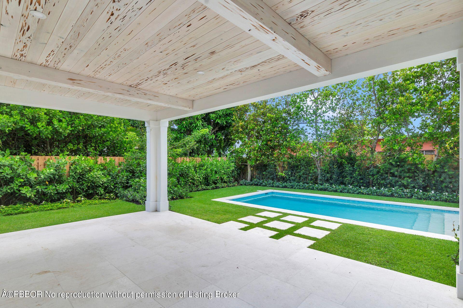 320 Sunset Road West Palm Beach, FL 33401 - Photo 31 of 35 a view of swimming pool with green yard