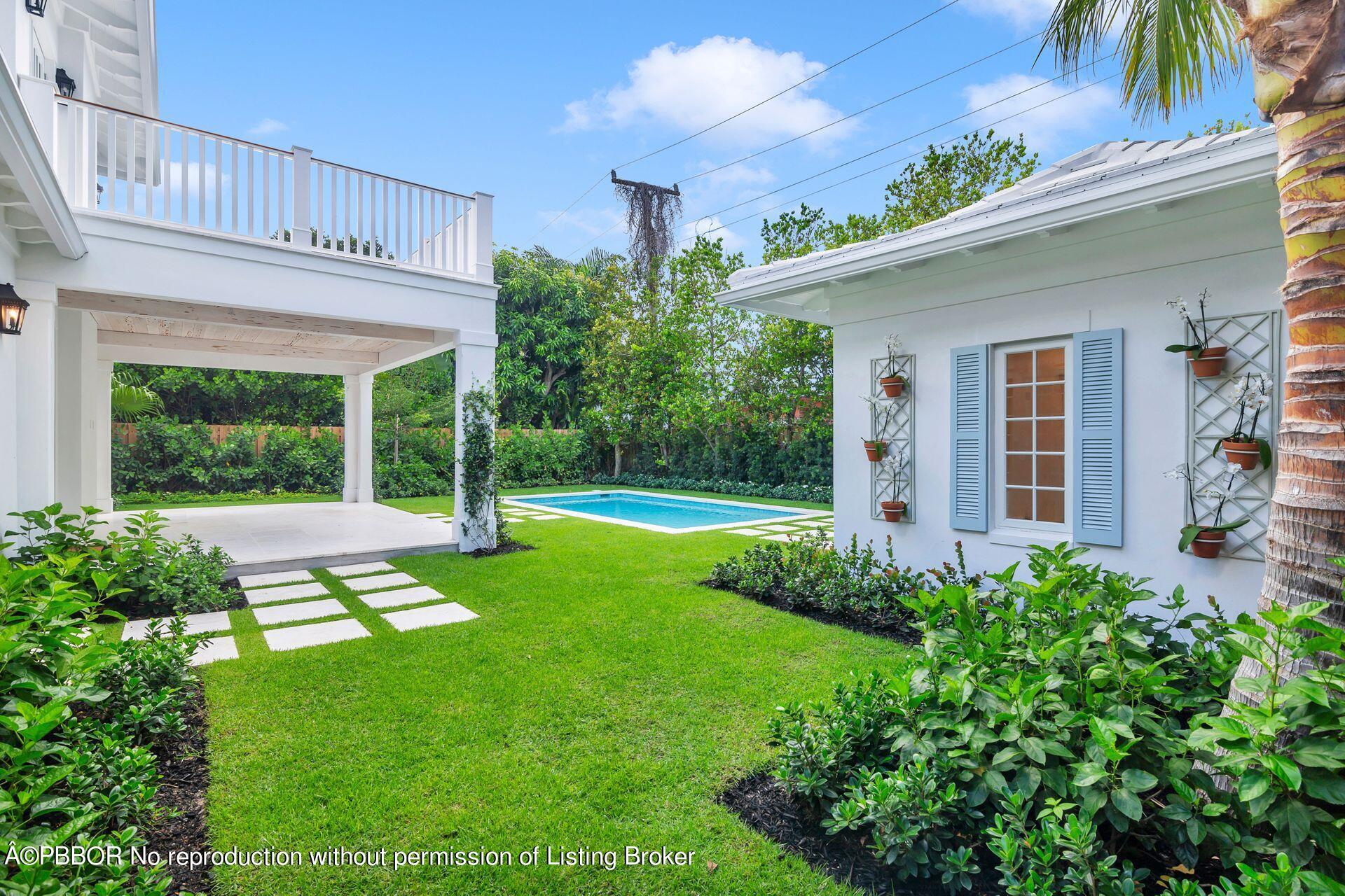 320 Sunset Road West Palm Beach, FL 33401 - Photo 32 of 35 a view of a house with a yard patio and a garden
