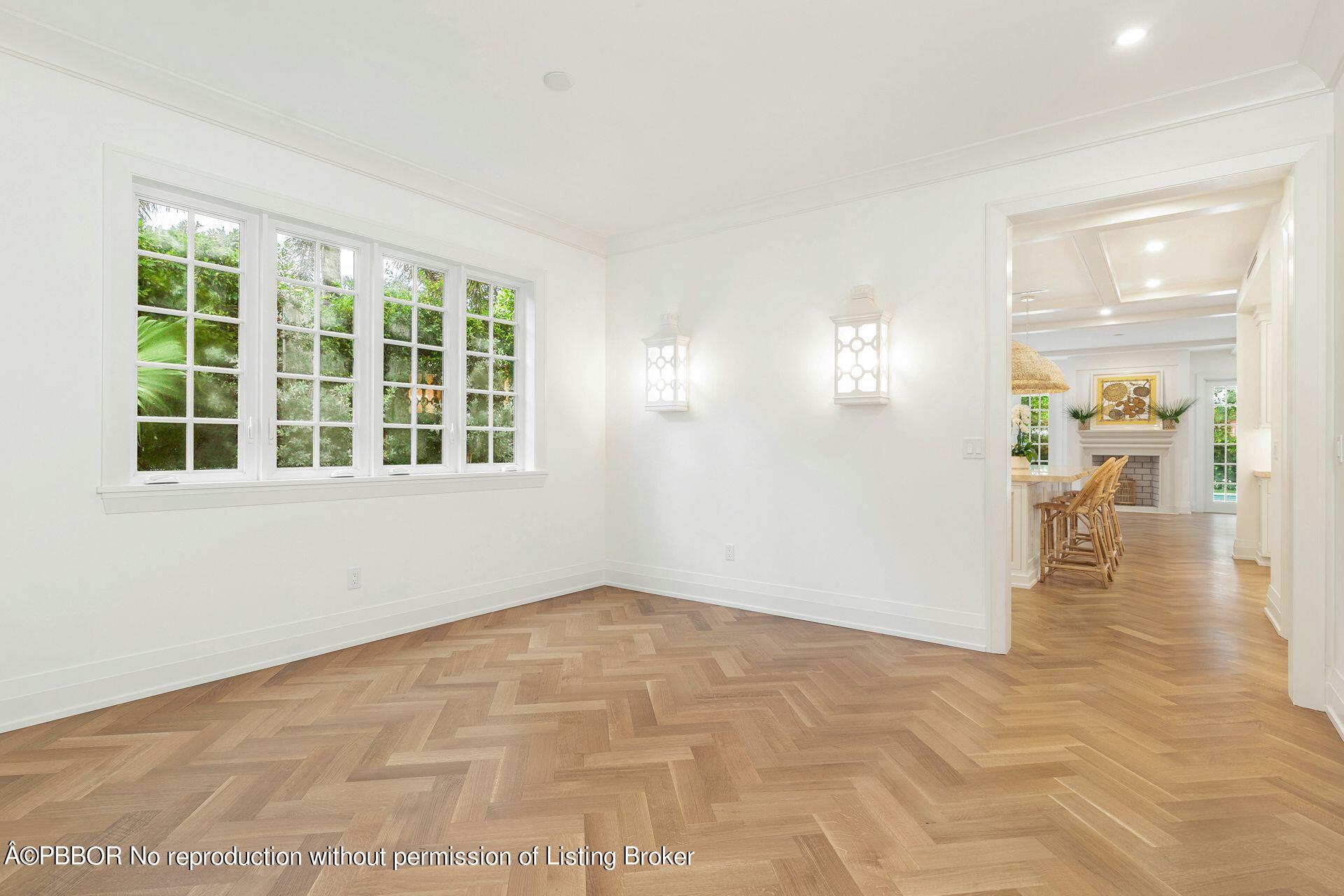 320 Sunset Road West Palm Beach, FL 33401 - Photo 7 of 35 a view of empty room with wooden floor and windows