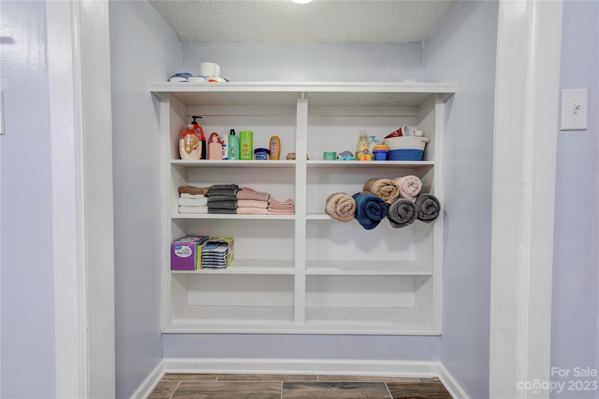 128 Burley's Knob Bostic, NC 28018 - Photo 14 of 19 a view of walk in closet with clothes and shoes