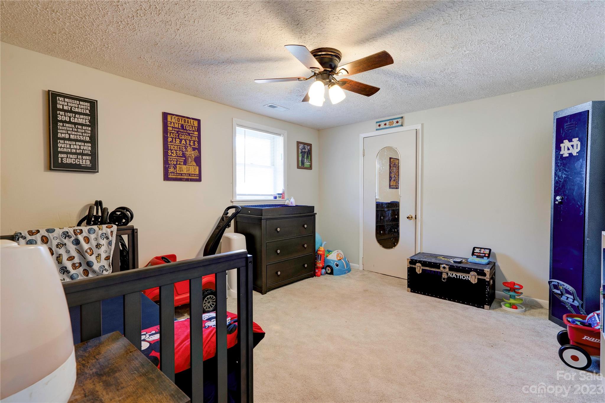 128 Burley's Knob Bostic, NC 28018 - Photo 15 of 19 a bedroom with furniture and a fan