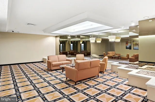 a living room with a couch and a dining table