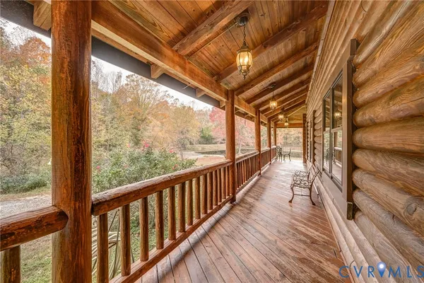 a view of a balcony with wooden floor