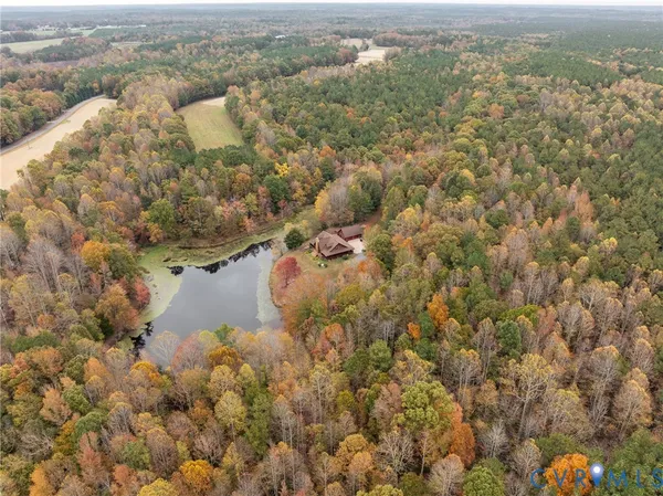 a front view of a house with a yard and mountain view