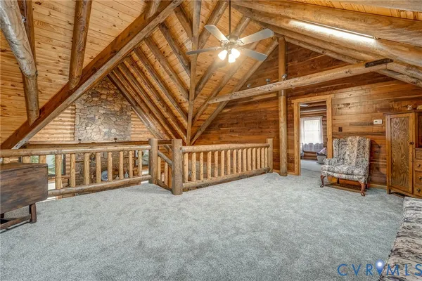 a bathroom with a granite countertop sink a mirror and shower