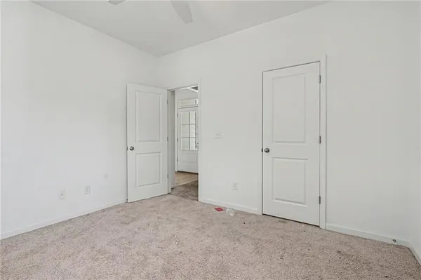 an empty room with closet area