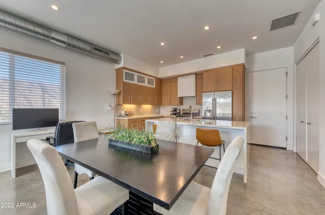 a view of kitchen with dining table and chairs