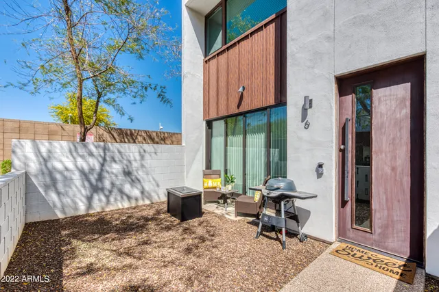 a building outdoor space with patio furniture