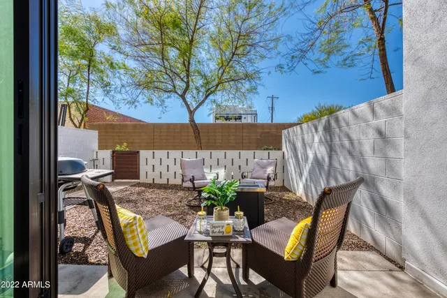 a view of a backyard with furniture