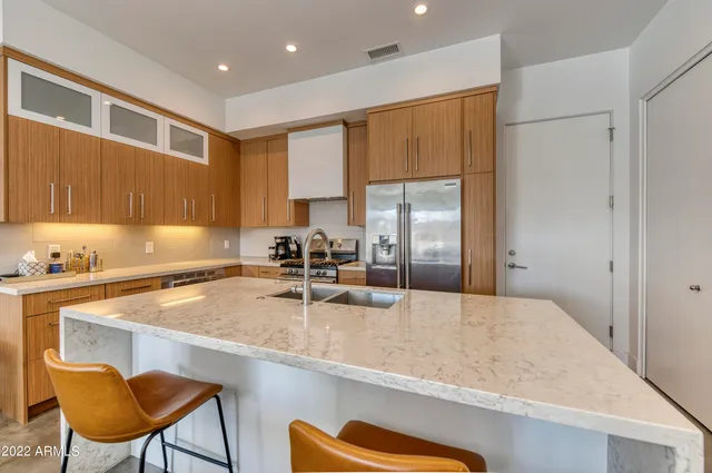 a kitchen with a sink cabinets and window