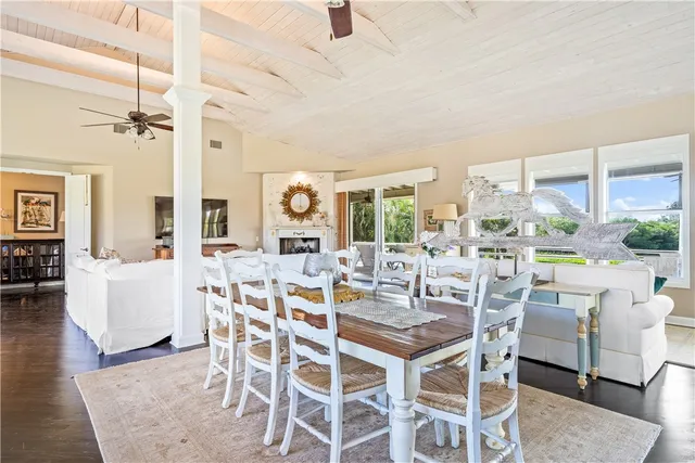 a kitchen with stainless steel appliances granite countertop a sink and large window