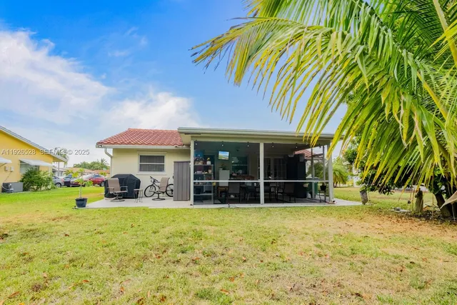a front view of a house with garden and porch