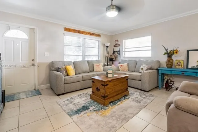 a living room with furniture and a window
