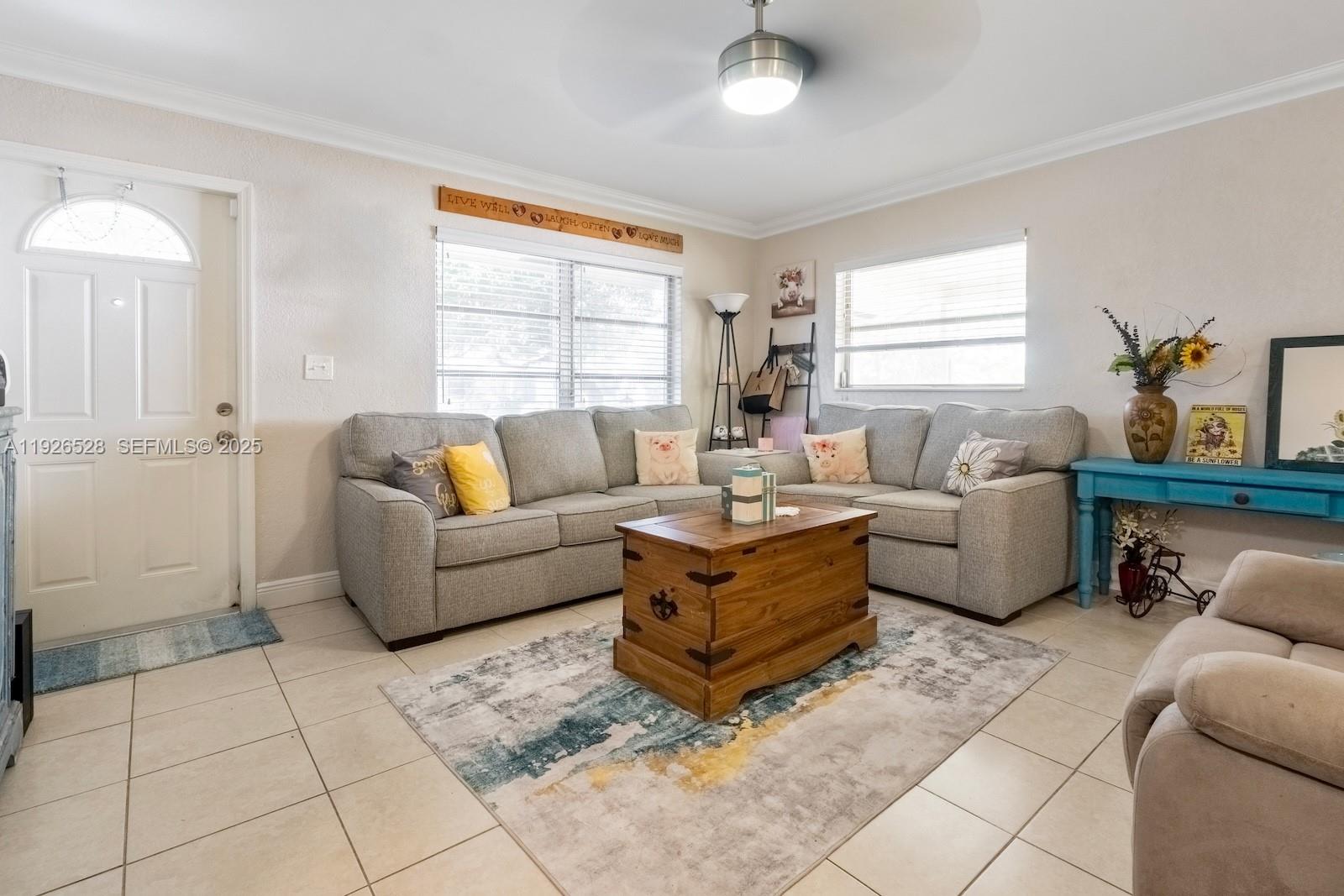 7002 Northwest 95th Avenue Tamarac, FL 33321 - Photo 2 of 12 a living room with furniture and a window