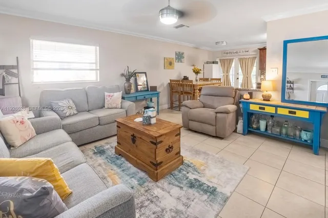 a living room with furniture and a window